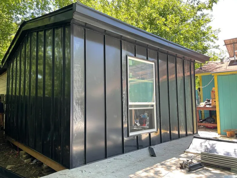 Black standing seam metal wall panels for Roof Inspection in Wright City